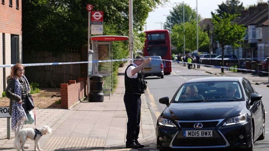 police talking to members of the public at the scene in hainault north east london tuesday april 30 2024 after reports of several people being stabbed at a tube station 1714474238