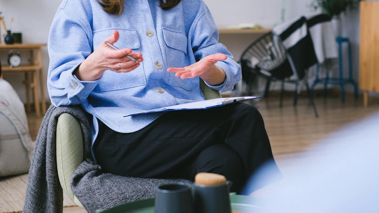 crop psychologist consulting patient in office