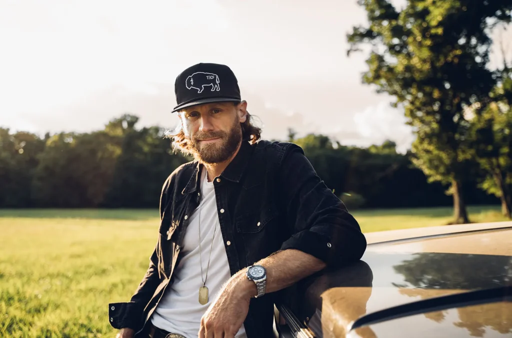 Chase Rice has shaken up the music industry by announcing his new album 'Eldora.' His upcoming release marks the most important milestone in his career that builds on his hit singles and growing influence in country music. The new project showcases his artistic evolution and musical growth. The album brings exciting collaborations to life, and country music veteran Jamey Johnson might join the mix. Rice's recent work stands as a match for artists like Morgan Wallen and Bruce Springsteen. He blends traditional country elements with contemporary sounds masterfully. His most ambitious project yet features multiple high-profile collaborations and explores fresh musical directions. Chase Rice's New Album 'Eldora' Announcement Chase Rice showed his creative power by completing nine songs in just three days for his upcoming album Eldora. His time in Colorado inspired this project that tells compelling stories and shows his progress as an artist. The album brings together several talented collaborators. "Two Tone Trippin'" features Wyatt McCubbin's vocals, and Irish singer-songwriter Foy Vance joins Rice on "Tall Grass". Rice marked this musical milestone by buying a 1922 Martin guitar that he named "Eldora". Eldora shows Rice's move toward authentic storytelling and timeless music that stands apart from his earlier hits. Each track adds to a unified musical experience that reveals his artistic development through meaningful narratives. Rice's excitement about the project shows in his quick release timeline. He wants to record all nine new songs and get the album to fans early next year. This fast-paced creative process proves his eagerness to share fresh music while staying true to his artistic vision. Potential Collaboration with Jamey Johnson Chase Rice might team up with country music legend Jamey Johnson, and he's thrilled about it. The "Bench Seat" singer can't wait to work with Johnson and already has the perfect song in mind. "I have a song that I want to write with Jamey Johnson. Like damn, it has him all over it," Rice said enthusiastically. Rice deeply respects Johnson and his lasting impact on country music. "He's an interesting one because for a long time, people forgot about him or he went away. What he does, that'll never go away. He's so good," Rice emphasized. His words show Johnson's powerful influence on the genre. This partnership means more than just recording together. It shows Rice's dedication to genuine country music storytelling. Johnson's traditional sound and masterful storytelling match Rice's current musical direction perfectly. Their creative paths could merge beautifully. If this collaboration happens, it would add genuine depth to Rice's musical identity, especially now that he has moved toward more traditional country elements in his songs. Evolution of Chase Rice's Musical Style Chase Rice's musical identity shows his artistic development. He started during what he calls the "Peak of Bro Country" and changed his approach to music-making completely. His career numbers are impressive with over 2.6 million albums sold and more than 2.8 billion streams across platforms. Rice's music took a new direction in 2020. He went back to writing with just an acoustic guitar and created his first solo composition in a decade. "It was the first song I've written by myself on a guitar in 10 years," he says about this defining moment. This change brought a more authentic sound with: More acoustic-driven compositions Story-focused songwriting Personal narrative elements Western-influenced melodies Rice has embraced a more mature musical direction at 38. His style no longer revolves around writing about "a girl and a truck and a perfect night". His recent songs demonstrate deeper storytelling and personal truth that reflect his growth as an artist and individual. "I just want people to know who I am through my music and know that it's not fake," Rice emphasizes. This new style appeals to fans and critics alike. It proves authenticity can drive success in country music effectively. Rice now creates songs that will "stand the test of time" instead of chasing temporary trends or radio hits. Other Collaborations and Future Projects Rice has begun an independent experience after leaving Broken Bow Records. This move gives him unprecedented creative freedom in his musical work. "It's very liberating," the country singer notes, as he can now choose his own songs and control his release schedule. His upcoming project showcases important collaborations. Four songs are co-written by Lori McKenna, who joins Rice for a duet on "That Word Don't Work No More." Rice has also planned writing sessions with Cleto Cordero of Flatland Cavalry to explore future shared work. The creative momentum extends beyond Eldora. His recent projects include: A songwriting session with Drake White, producing "Kill the Boy" Plans for an Appalachia-themed album inspired by his time in Carolina Nine new songs written during a three-day creative burst in Colorado "I feel like my whole music catalog is getting better and better as we go," Rice reflects on his artistic path. His independent status energizes his creative process and leads to an impressive collection of material for future releases. His steadfast dedication to authentic storytelling and musical progress continues to shape his future in the country music world. Conclusion Chase Rice has moved from "bro country" hitmaker to authentic storyteller, marking a notable development in country music. His upcoming album 'Eldora' shows this transformation. He collaborates with artists like Jamey Johnson and Lori McKenna, while his independent status gives him complete creative control over his music's direction. His return to acoustic-driven compositions and strategic decisions show his steadfast dedication to creating lasting, meaningful music that strikes a chord with audiences deeply. Rice's songwriting sessions and ambitious timeline reveal an artist at his creative peak. His move toward personal stories and traditional country elements shows through projects like 'Eldora' and his planned Appalachia-themed album. This artistic rebirth, supported by strong streaming numbers and album sales, proves that authentic storytelling still finds its audience in today's music world.