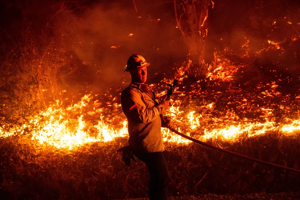 firefighter prepares douse flames battling 93195496